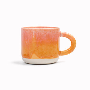 Mandarin is a heavily glazed vibrant orange, Japanese inspired ceramic mug from Studio Arhoj. The Chug Mug features their trademark thick, hand poured coloured glaze which means that each mug is unique.