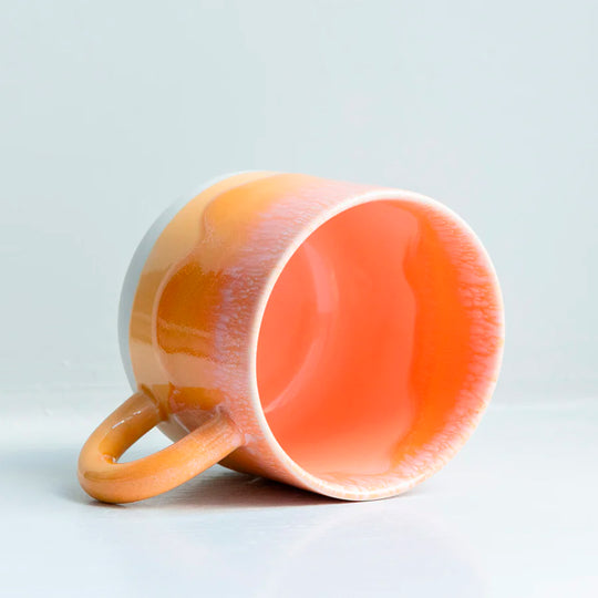 Mandarin is a heavily glazed vibrant orange, Japanese inspired ceramic mug from Studio Arhoj. The Chug Mug features their trademark thick, hand poured coloured glaze which means that each mug is unique.