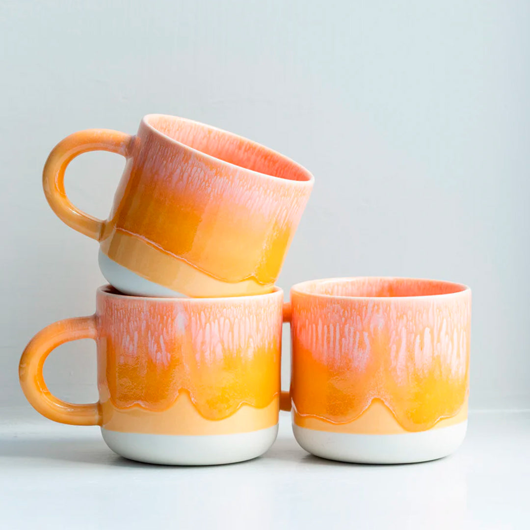 Mandarin is a heavily glazed vibrant orange, Japanese inspired ceramic mug from Studio Arhoj. The Chug Mug features their trademark thick, hand poured coloured glaze which means that each mug is unique.