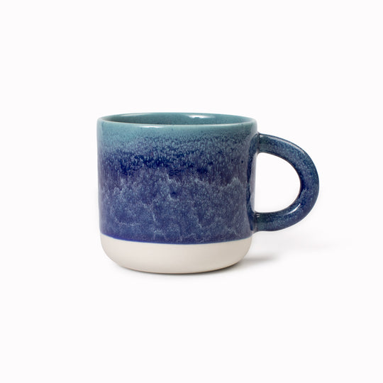 Mariana is a blue hued heavy glazed, Japanese inspired ceramic mug from Studio Arhoj. The Chug Mug features their trademark thick, hand poured coloured glaze which means that each mug is unique.