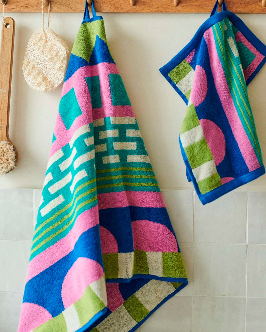 The Circus Collection of Towels from Donna Wilson is a vibrant colour filled graphic illustration inspired by the magic of the big top.