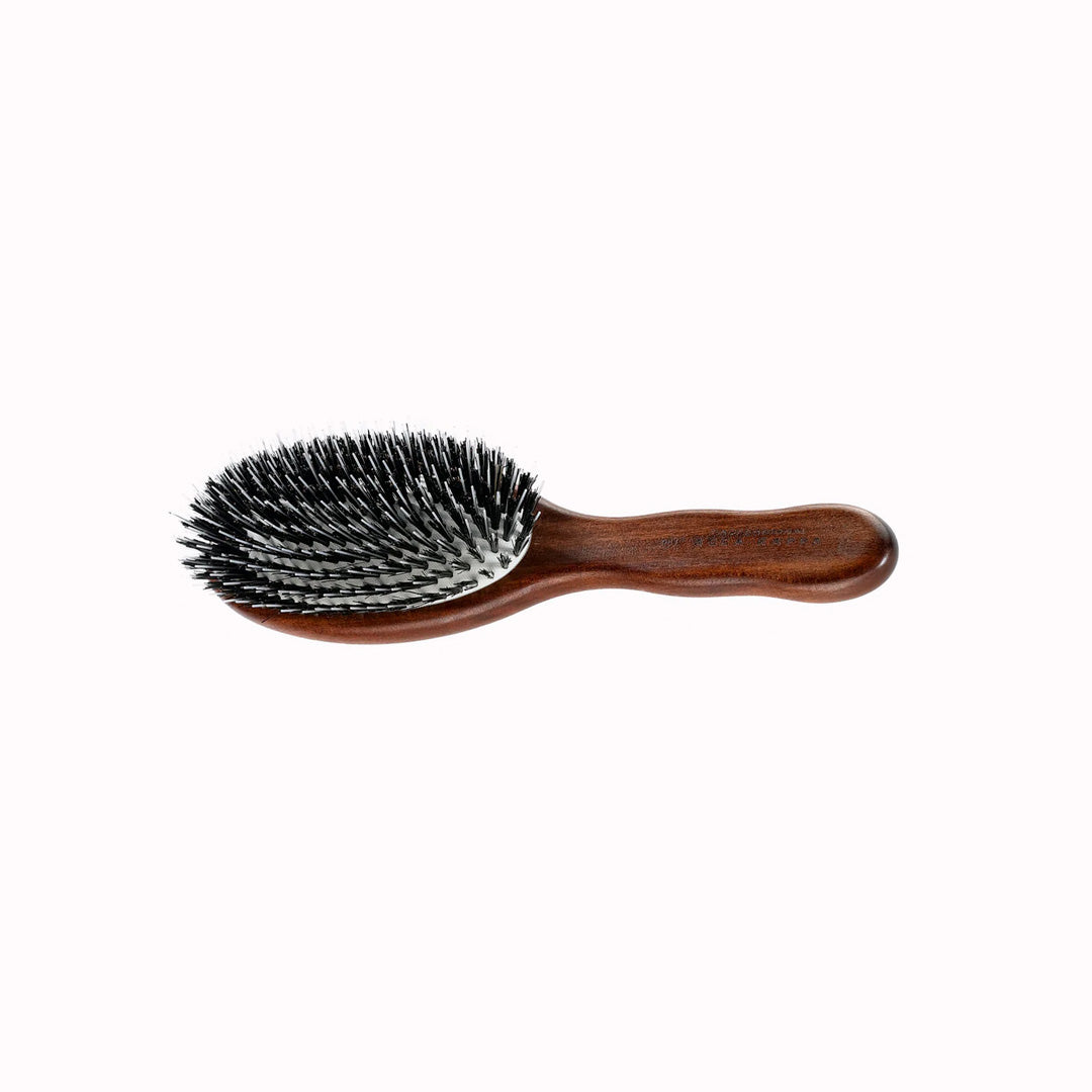 The Classic Oval Brush with Mixed Bristles from Acca Kappa is a reflection of the brand's dedication to quality and tradition in haircare. Crafted from hand-finished Kotibé wood,