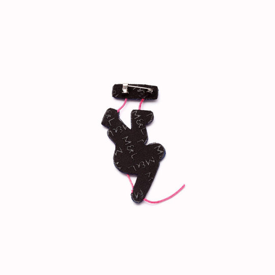 Climbing is a hand embroidered decorative brooch from French Accessory brand Macon et Lesquoy for their summer 2024 collection, inspired by the 2024 Paris Olympics. - Rear View