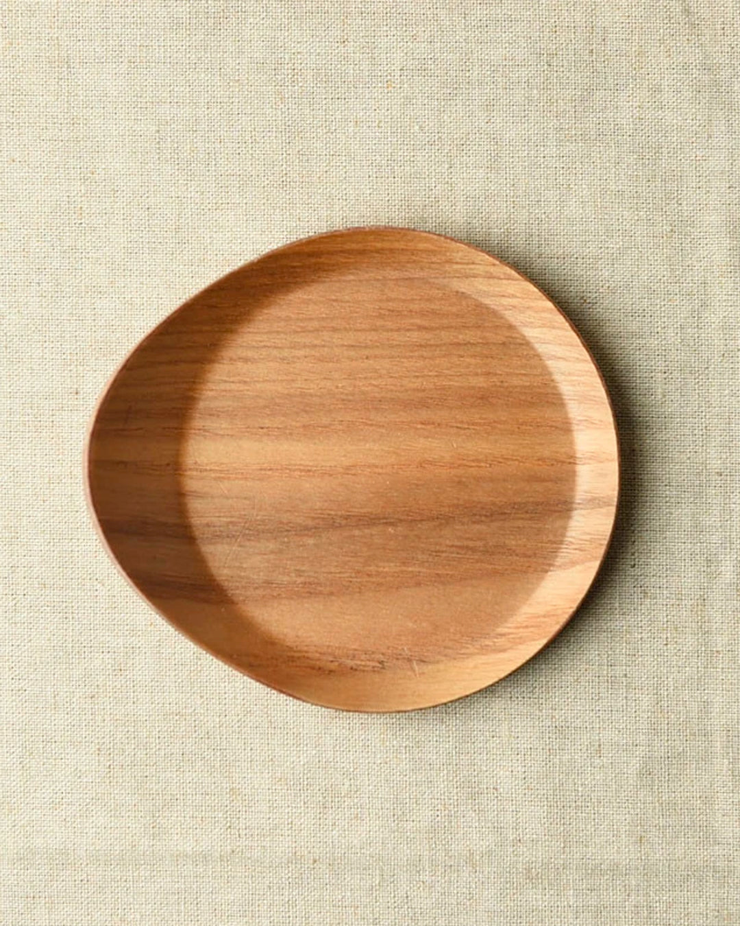 Tear drop shaped wooden coaster with bevelled edges to contain any unwanted drips.
