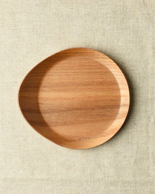 Tear drop shaped wooden coaster with bevelled edges to contain any unwanted drips.