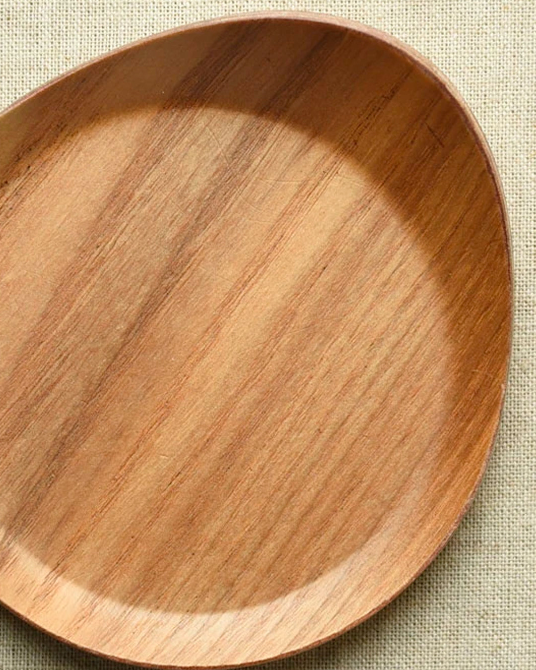 Tear drop shaped wooden coaster with bevelled edges to contain any unwanted drips.