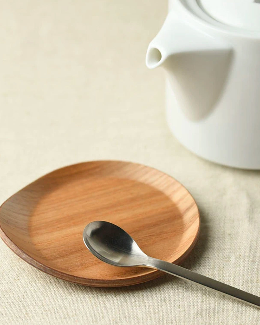 Tear drop shaped wooden coaster with bevelled edges to contain any unwanted drips.