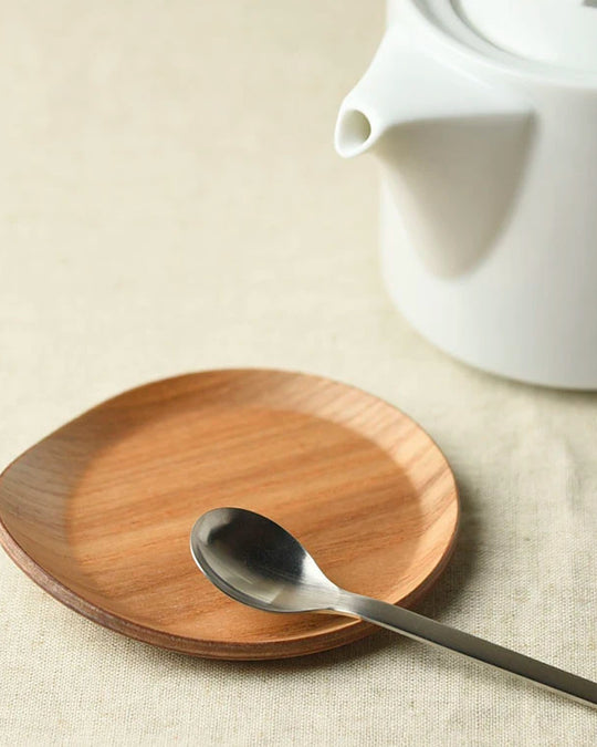 Tear drop shaped wooden coaster with bevelled edges to contain any unwanted drips.
