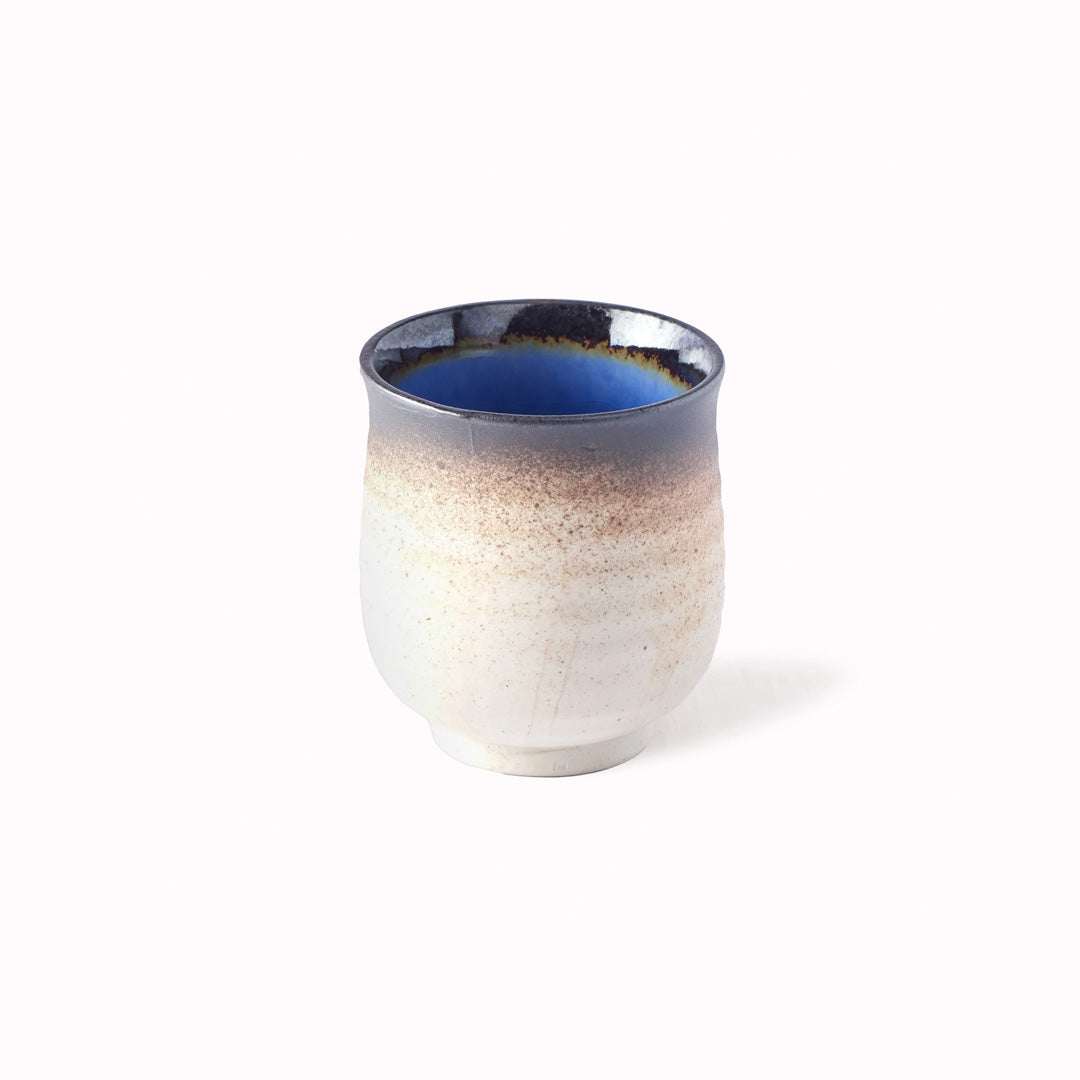 250ml capacity ceramic cup in a soft brown outer glaze with a bright cobalt blue inside finish.