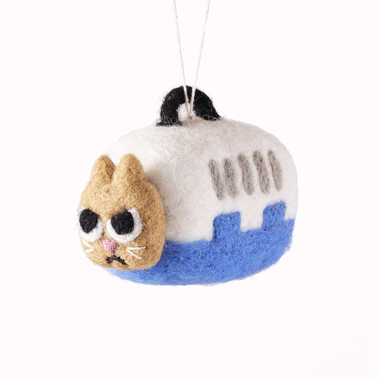 Coco is not a happy cat because Coco is going to the vet! Cute and relatable, Coco the cat is playful felted Christmas tree decoration designed by Elliot Kruszynski.