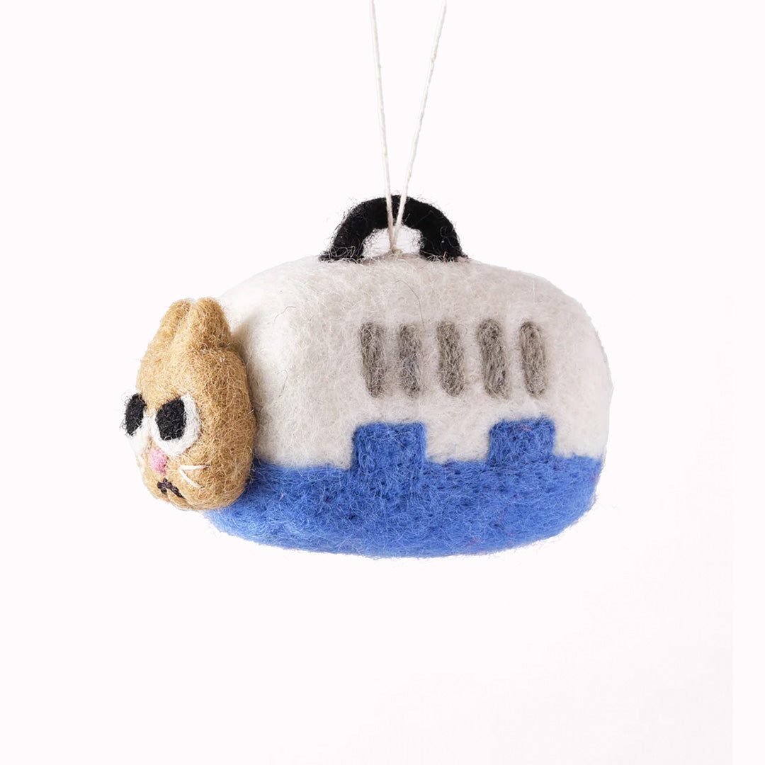 Coco is not a happy cat because Coco is going to the vet! Cute and relatable, Coco the cat is playful felted Christmas tree decoration designed by Elliot Kruszynski.