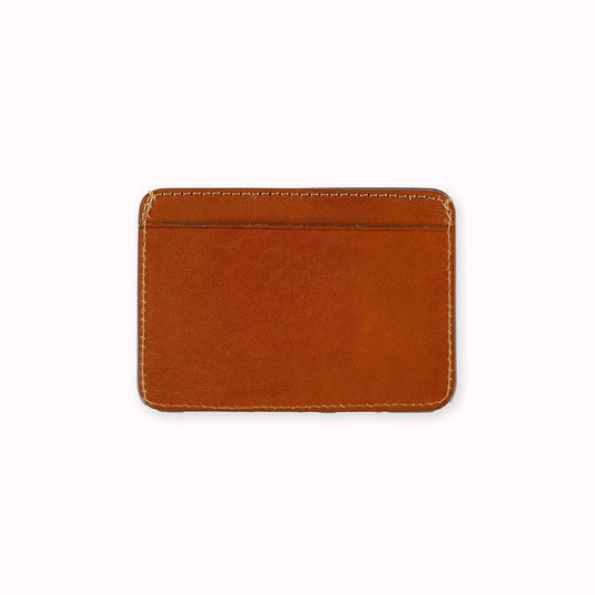 A slim and stylish cardholder from Escuyer, in Cognac brown leather. The cardholder is handmade by Portuguese artisans, using vegetable-tanned leather from a tannery in Tuscany, Italy.