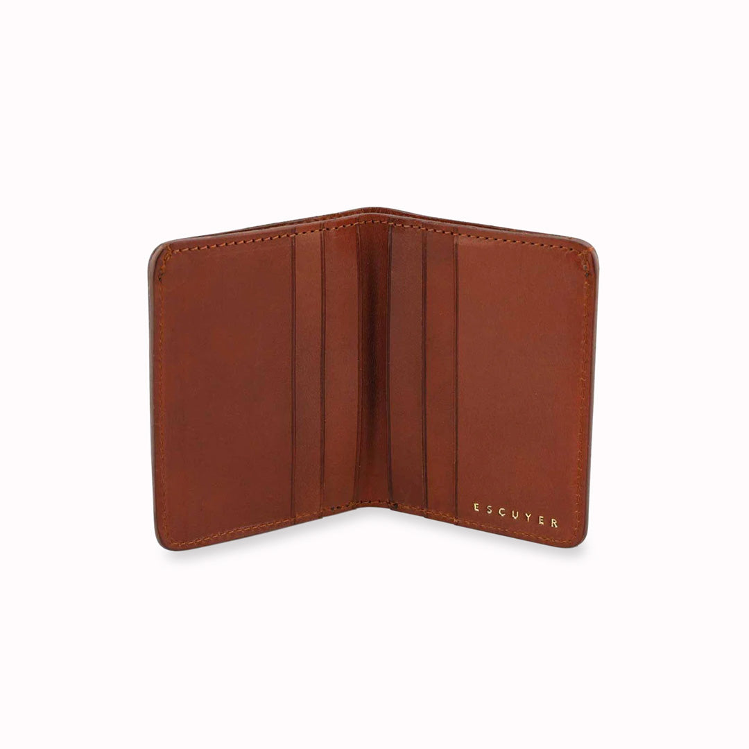 Cognac slim leather wallet open from Escuyer, in a rich Cognac brown toned leather. Handmade by Portuguese artisans from leather sourced from a tannery in Tuscany, Italy.