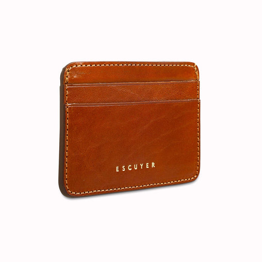 A slim and stylish cardholder from Escuyer, in Cognac brown leather. The cardholder is handmade by Portuguese artisans, using vegetable-tanned leather from a tannery in Tuscany, Italy.