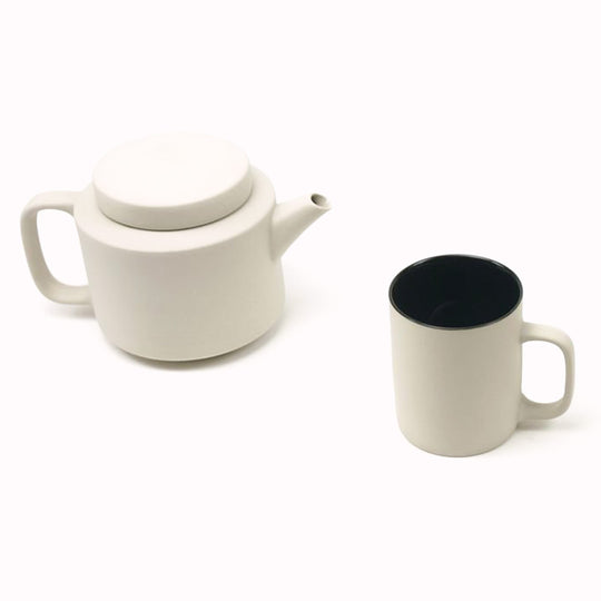 Large stoneware teapot with mug from Dutch company Kinta who produce contemporary ceramics and homeware. The large teapot is clay grey in colour, with a soft matt exterior finish.