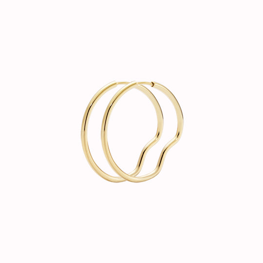 Gold Hoop - This hoop features a bend placed north, south, east and west, representing Copenhagen the city they were designed in.