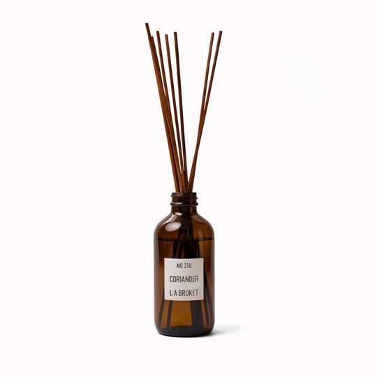 A wonderful room diffuser with a fresh scent of coriander and mint leaves from&nbsp;L:A Bruket, presented in an amber glass bottle with natural rattan reed sticks.