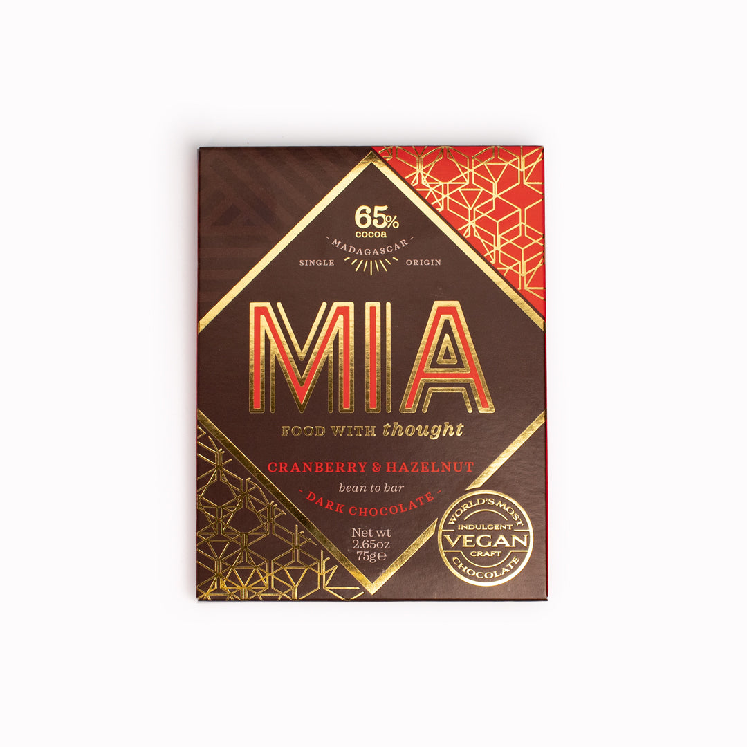 MIA's Cranberry and Hazelnut bean-to-bar chocolate pairs 65% dark chocolate with dried cranberries, roasted hazelnuts and a sprinkling of cinnamon. Its flavour roams between sweet and sour with a nutty crunch and notes of woody spice.
