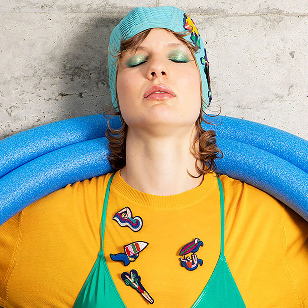 Make a splash! Statement piece brooch from the Macon et Lesquoy summer 2024 collection, inspired by the 2024 Paris Olympics. Swimming themed hand embroidered decorative lapel pin - personalise your favourite garments to define your individual style. Lifestyle