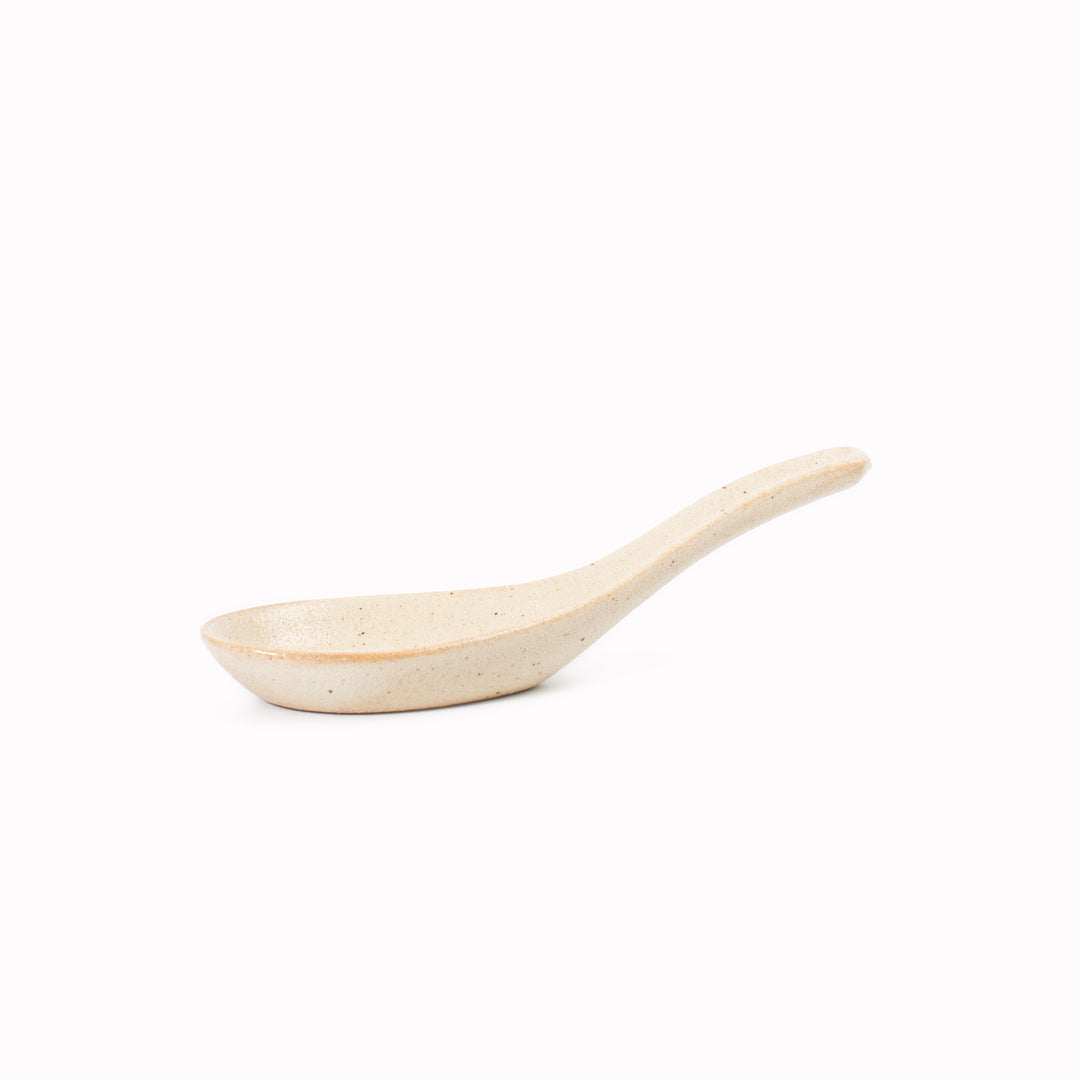 Japanese soup spoon in a soft speckled cream glaze, made of 'Minoyaki' porcelain, fired at a high temperature and hand finished in Gifu prefecture, Japan.