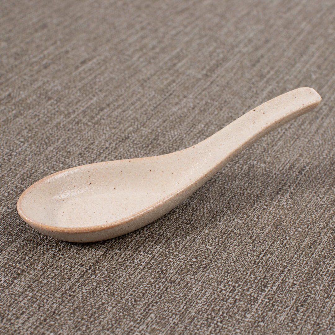 Japanese soup spoon in a soft speckled cream glaze, made of 'Minoyaki' porcelain, fired at a high temperature and hand finished in Gifu prefecture, Japan.