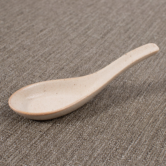 Japanese soup spoon in a soft speckled cream glaze, made of 'Minoyaki' porcelain, fired at a high temperature and hand finished in Gifu prefecture, Japan.
