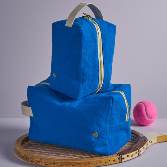 The medium Pouch Cube in Blue Mecano / Ultramarine from French brand is a very practical and stylish travel wash or makeup bag. 