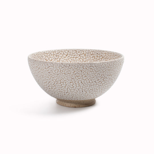Danish Designers Studio Arhoj are renowned for their unique and colourful ceramics and the Curdle Spring Bowl with textured white glaze is no exception - Main