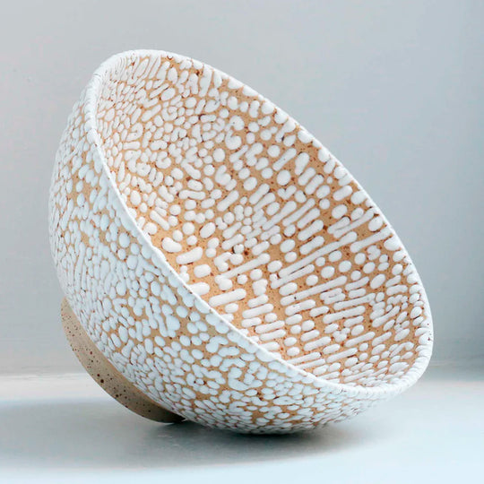 Danish Designers Studio Arhoj are renowned for their unique and colourful ceramics and the Curdle Spring Bowl with textured white glaze is no exception - angled