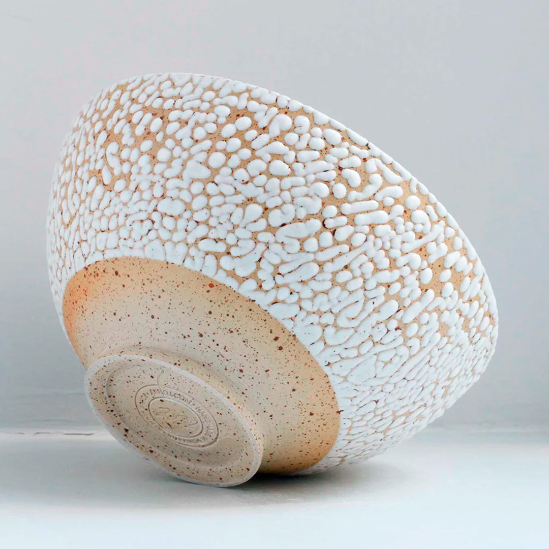 Danish Designers Studio Arhoj are renowned for their unique and colourful ceramics and the Curdle Spring Bowl with textured white glaze is no exception - rear angled