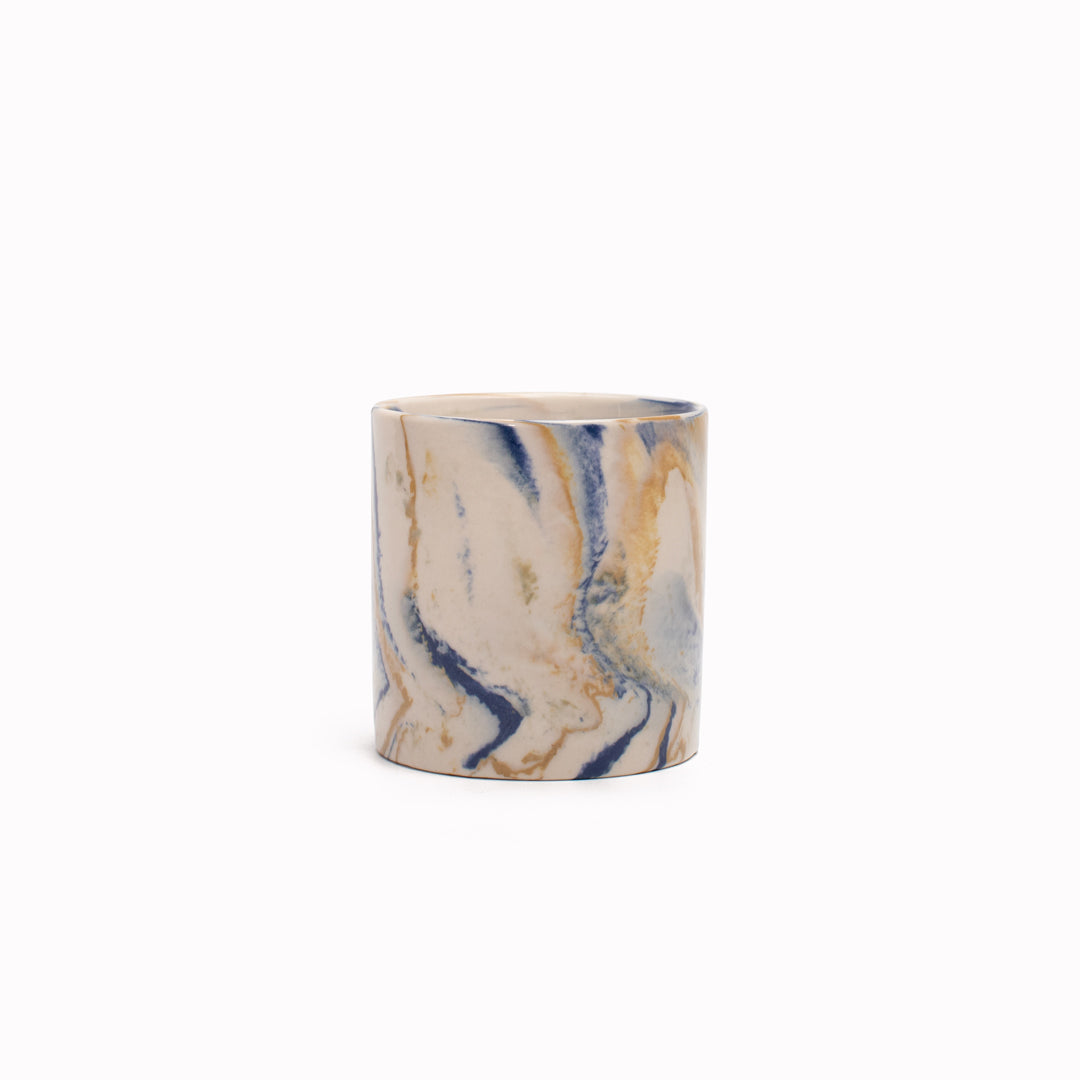 Blue and mustard marbled gloss glaze cup from Dutch company Kinta, who produce contemporary ceramics and homeware. The stoneware cup has a striking marbled effect glaze with blue and mustard colouring. The glaze on the outside and on the interior is glossy and it holds 150ml