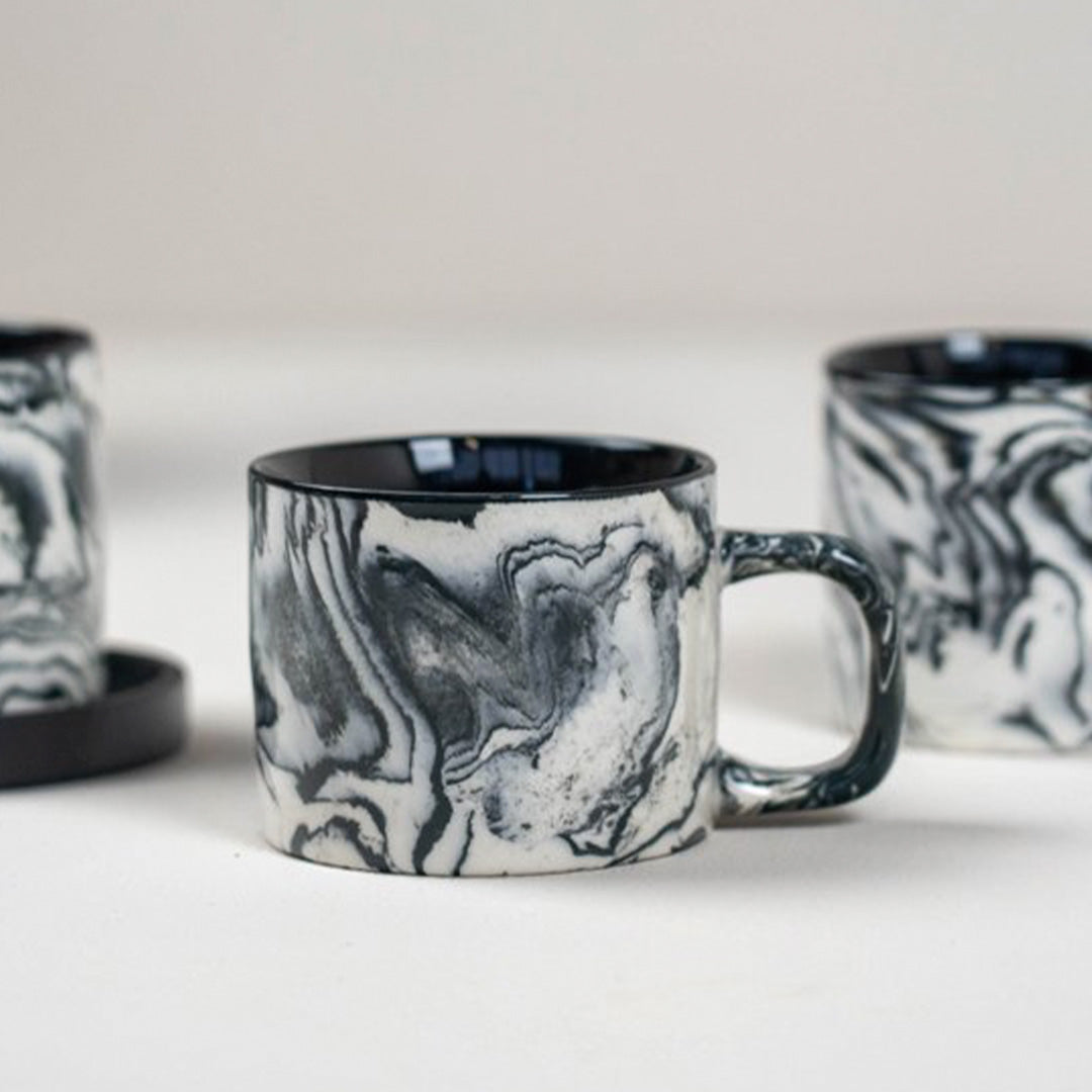 Lifestyle image, 200ml Black & White marbled gloss glaze mug from Dutch company Kinta