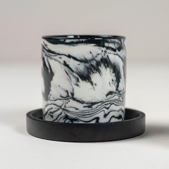 Lifestyle Detail of Black & White marbled gloss glaze mug from Dutch company Kinta