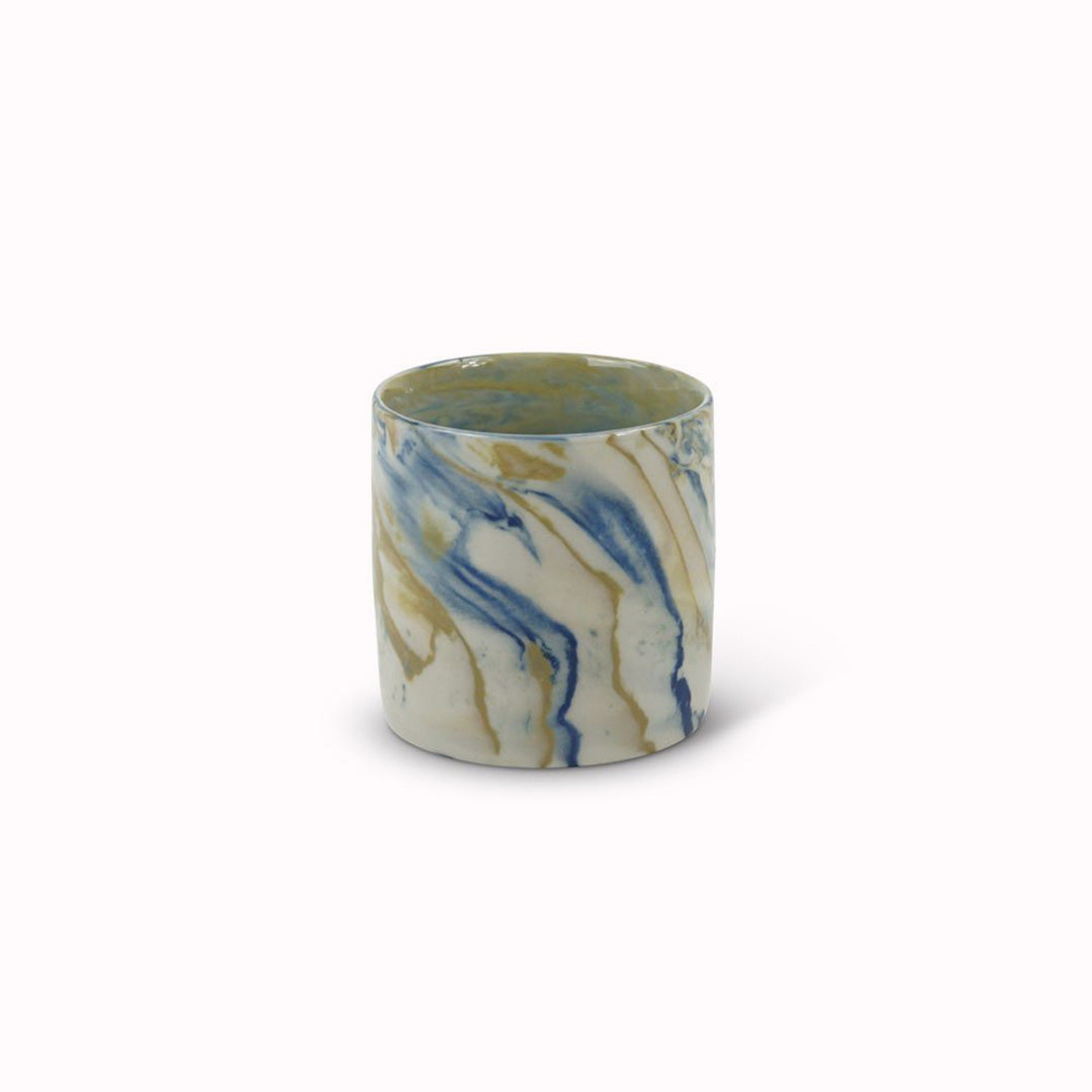 Blue and mustard marbled gloss glaze cup from Dutch company Kinta, who produce contemporary ceramics and homeware. The stoneware cup has a striking marbled effect glaze with blue and mustard colouring. The glaze on the outside and on the interior is glossy and it holds 150ml 