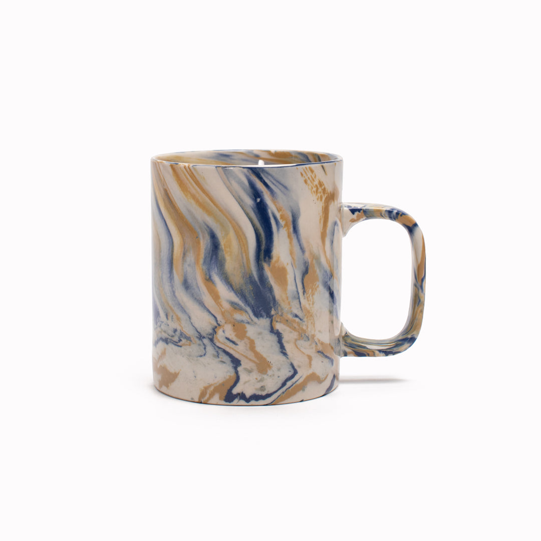 Blue and mustard marbled gloss glaze mug from Dutch company Kinta, who produce contemporary ceramics and homeware. The stoneware mug has a striking marbled effect glaze with blue and mustard colouring. The glaze on the outside and on the interior is glossy and it holds 350ml
