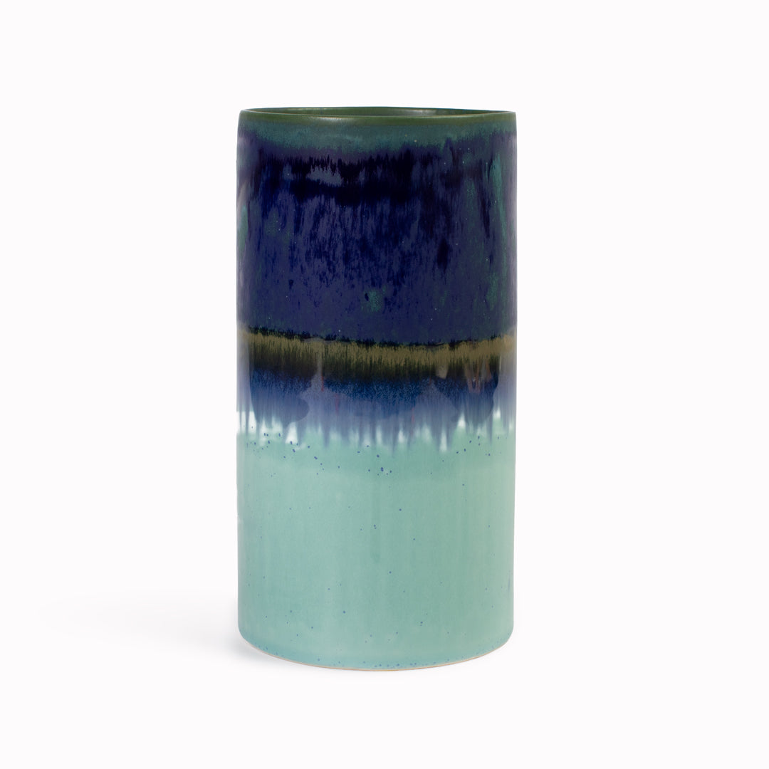 Extra Large Porcelain cylinder vase from London based SGW Lab, glazed in tonal shades of green through to blue.