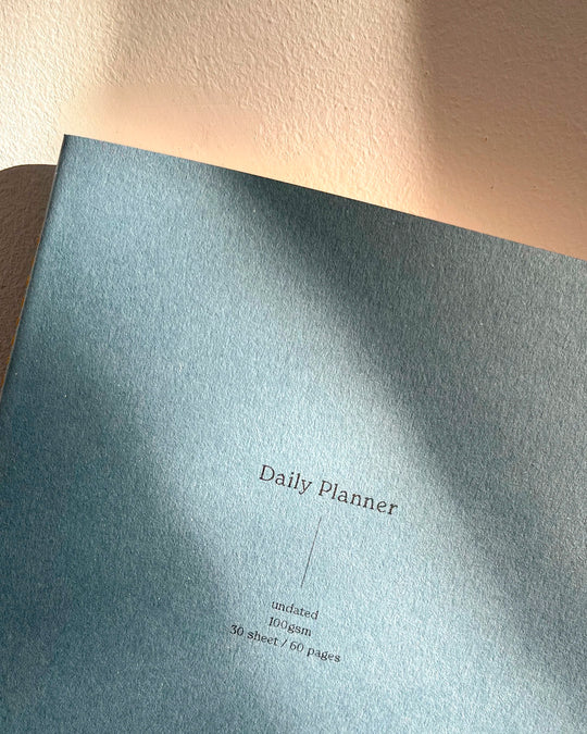 planner built around a horizontal grid layout, giving structure without locking the page. Each spread balances planning and open space, with enough room to map the week while keeping things visually light.