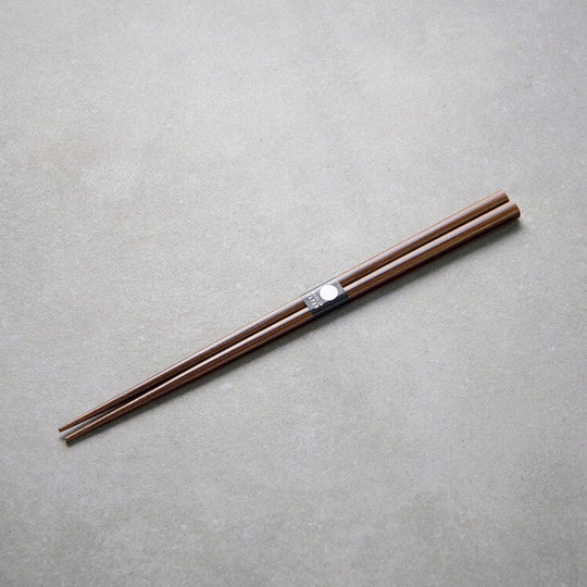 Dark Bamboo lacquered chopsticks from Made in Japan. This Chopstick collection is designed and made at the Zumi workshop in Fukui prefecture, Japan. This region of Japan has a 1500-year-old history of crafting with Lacquer.