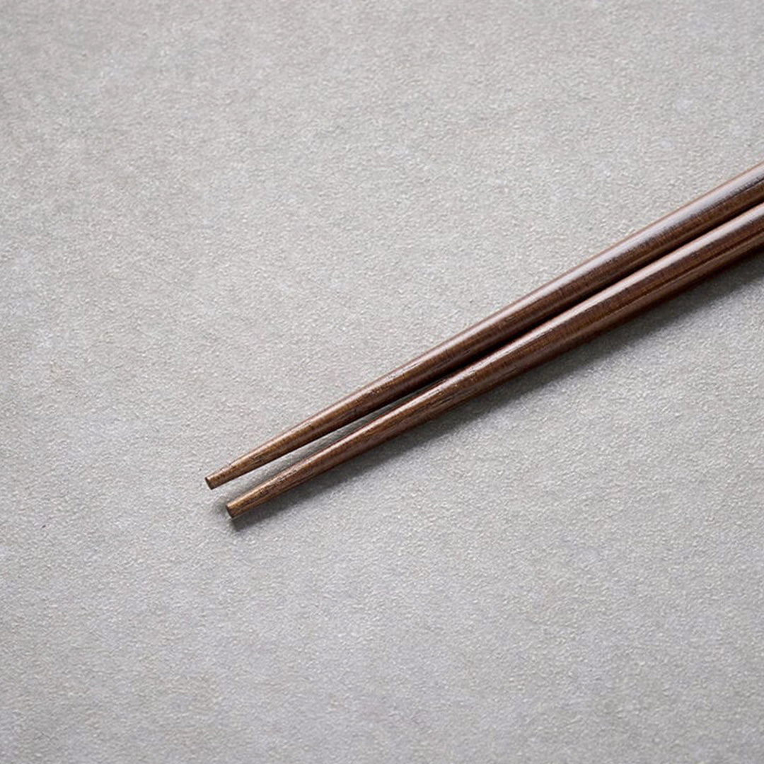 Dark Bamboo lacquered chopsticks from Made in Japan. This Chopstick collection is designed and made at the Zumi workshop in Fukui prefecture, Japan. This region of Japan has a 1500-year-old history of crafting with Lacquer.