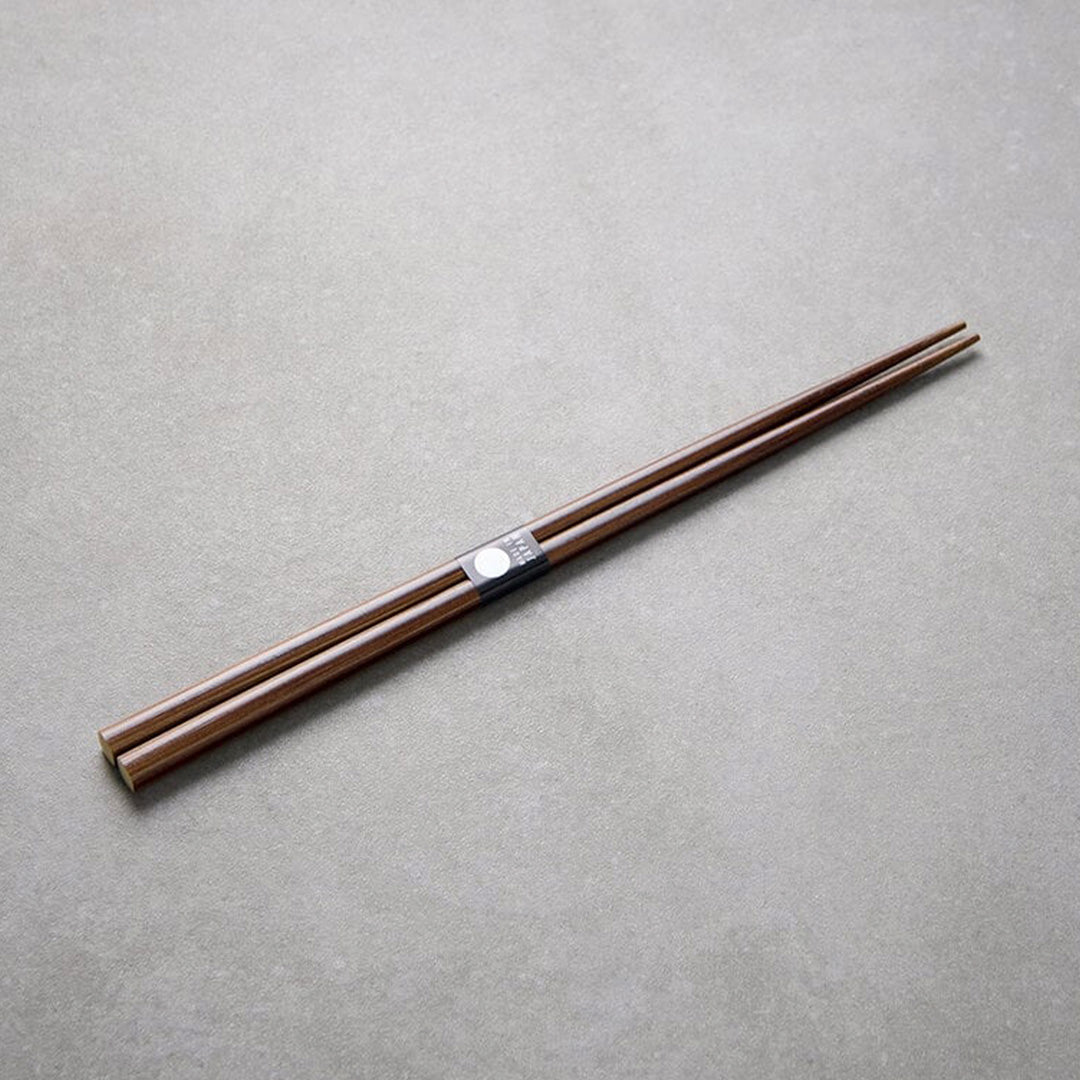 Dark Bamboo lacquered chopsticks from Made in Japan. This Chopstick collection is designed and made at the Zumi workshop in Fukui prefecture, Japan. This region of Japan has a 1500-year-old history of crafting with Lacquer.