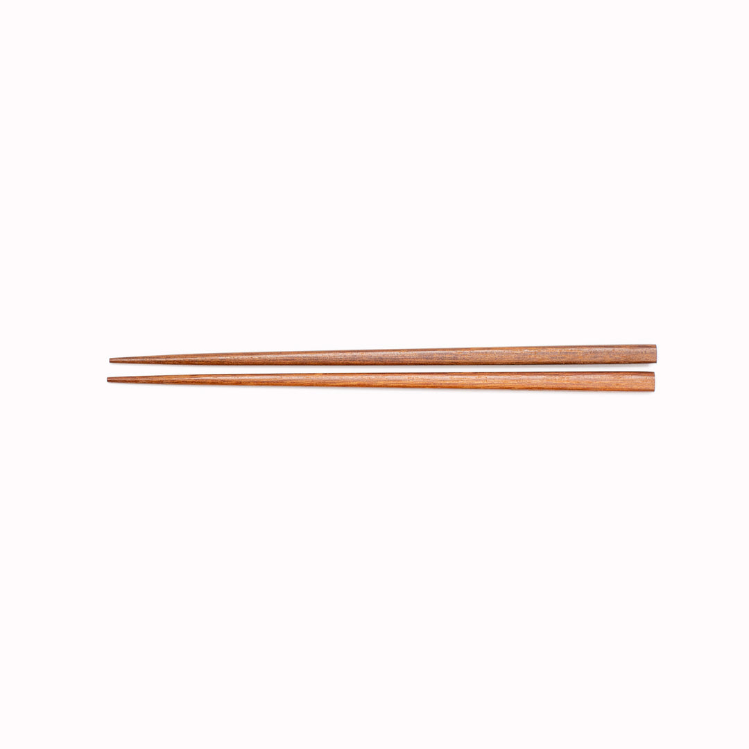 Dark Wood Chopsticks from Made in Japan. Chopsticks have been used as kitchen and eating utensils in East Asia for over two million years. These chopsticks are a natural wood chopstick they feel great in the hand and have a lovely taper to their edge.