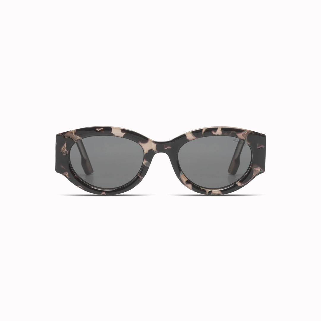 Make a statement with the Dax, part of the Fader Collection. All styles of the Fader collection feature the signature oversized temples that really makes this pair of sunglasses stand out. The Dax has oval shaped lenses, set in a Bioplastic frame that measures at a slighter wider fit. Featuring a mottled black/grey ink Bio Nylon frame with signature wide arms and solid smoke lenses, the Dax Ink is perfect for those who love to make an impact!