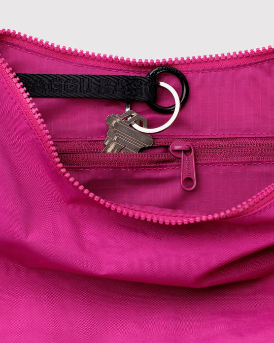 Made from recycled heavyweight nylon with a ripstop lining, it holds its form while staying lightweight. 