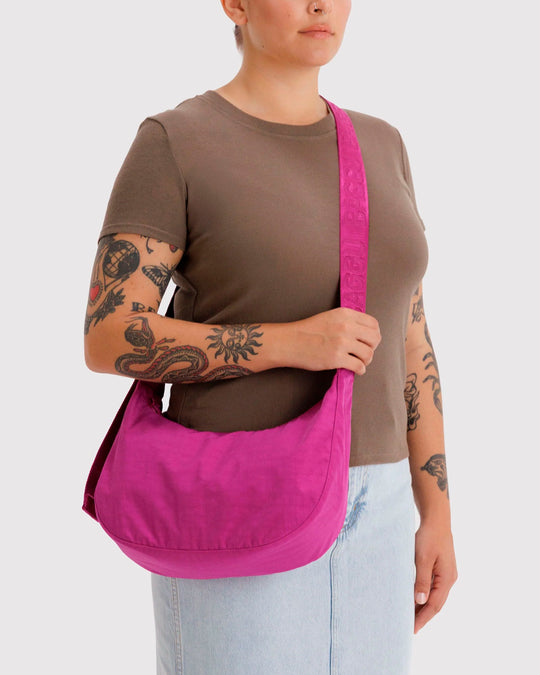 Made from recycled heavyweight nylon with a ripstop lining, it holds its form while staying lightweight. 