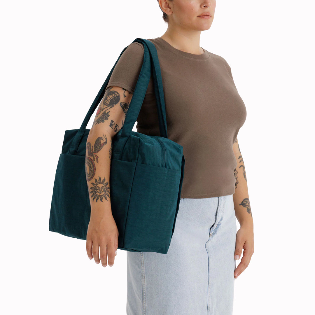 The small 'Cloud' Carry-On from Baggu is constructed from durable heavyweight nylon. Its versatile design has been optimised for air travel where its size allows it to fit under an aeroplane seat. 