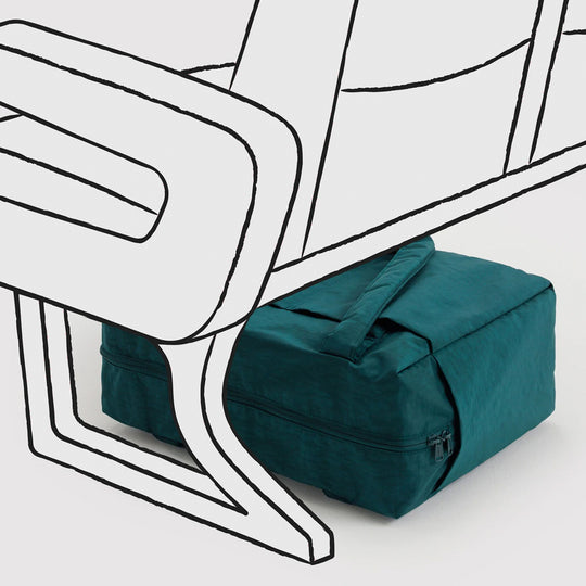 The small 'Cloud' Carry-On from Baggu is constructed from durable heavyweight nylon. Its versatile design has been optimised for air travel where its size allows it to fit under an aeroplane seat. 