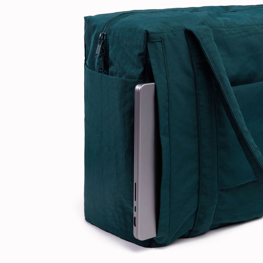 The small 'Cloud' Carry-On from Baggu is constructed from durable heavyweight nylon. Its versatile design has been optimised for air travel where its size allows it to fit under an aeroplane seat. 