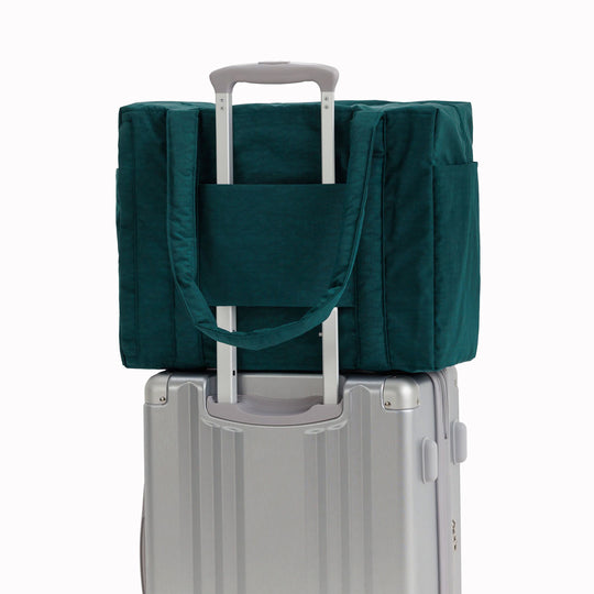 The small 'Cloud' Carry-On from Baggu is constructed from durable heavyweight nylon. Its versatile design has been optimised for air travel where its size allows it to fit under an aeroplane seat. 
