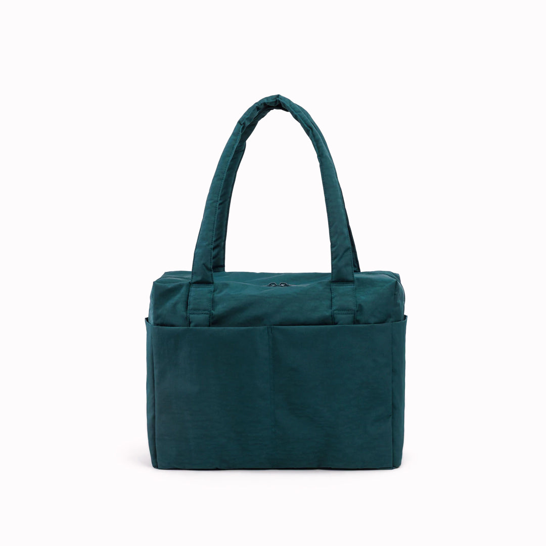 The small 'Cloud' Carry-On from Baggu is constructed from durable heavyweight nylon. Its versatile design has been optimised for air travel where its size allows it to fit under an aeroplane seat. 