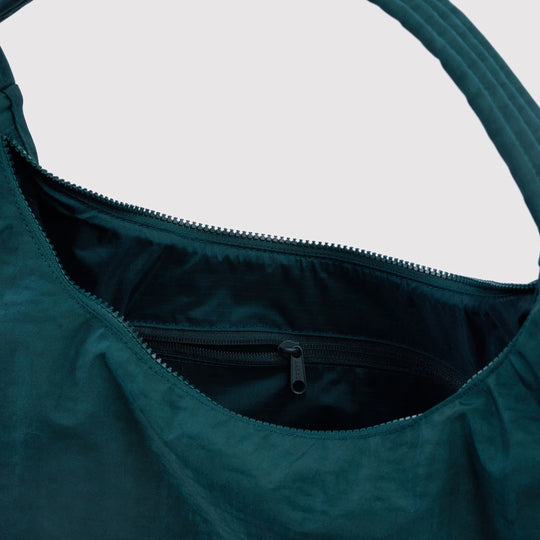 Practical shoulder bag designed for daily use and urban mobility. Crafted from recycled heavyweight nylon with a recycled ripstop lining